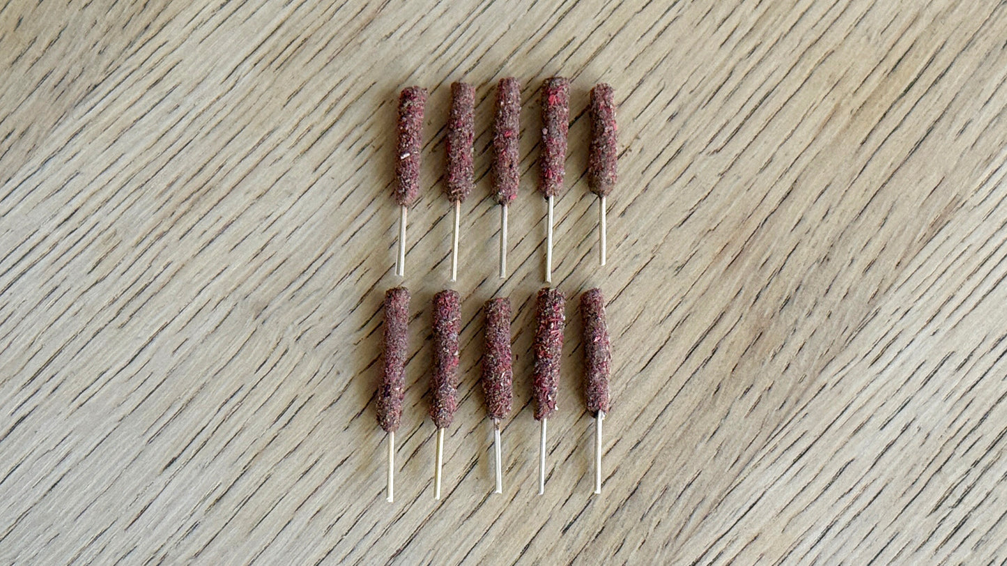 Set of 10 Mini Sage Sticks on a wooden surface.